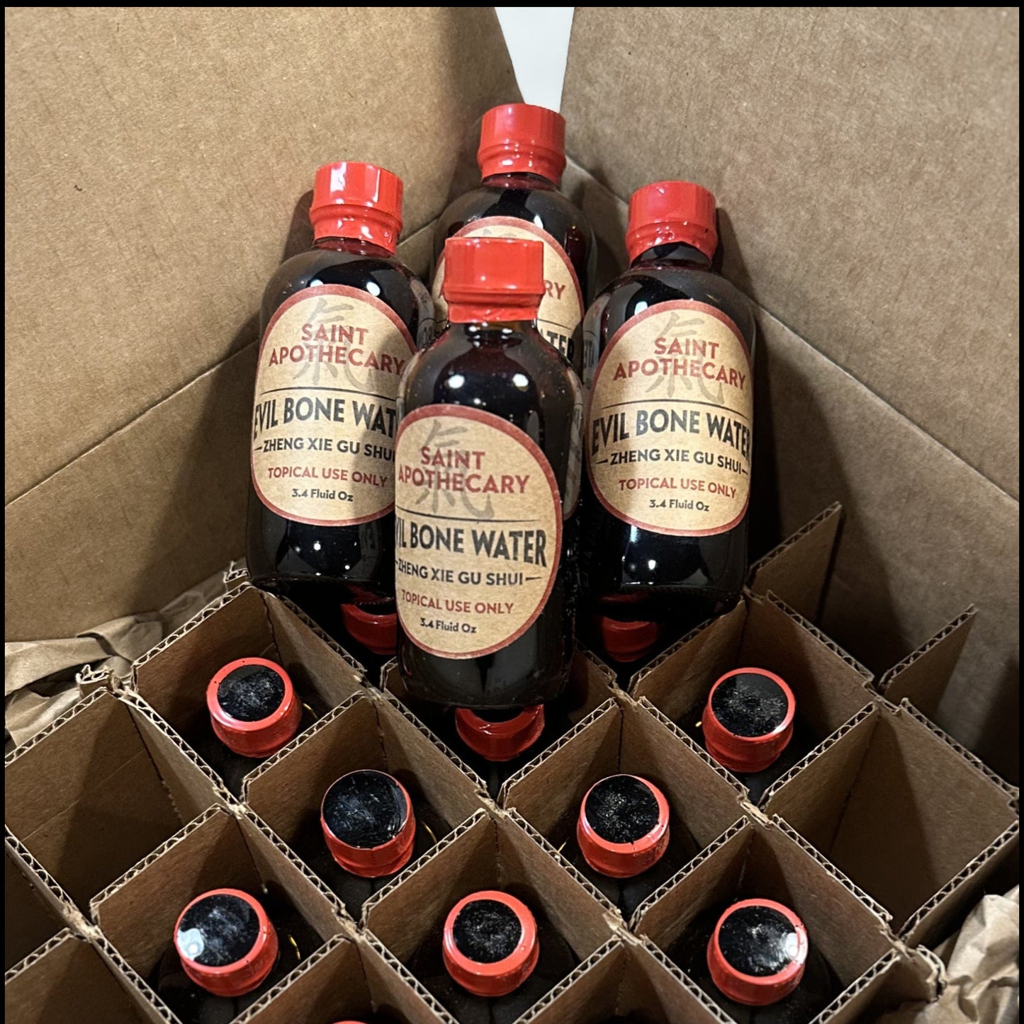 Bottles of Evil Bone Water Water in a cardboard box