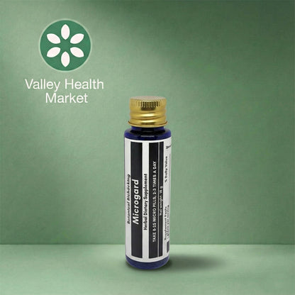 Botanical Biohacking's Microgard with a gold cap on a green background, featuring the Valley Health Market logo.