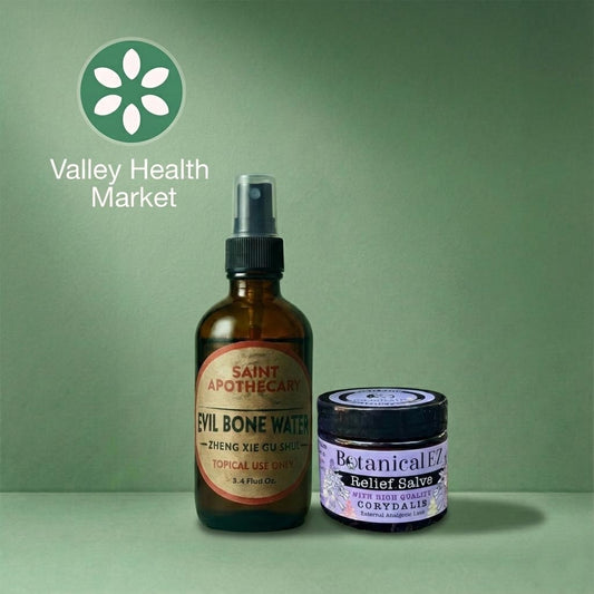 Saint Apothecary's Evil Bone Water and Botanical EZ's Corydalis Relief Salve on a green background with Valley Health Market logo.