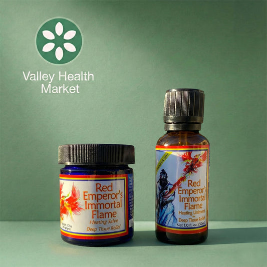 Two bottles of Red Emperor's Immortal Flame from Valley Health Market on a green background.